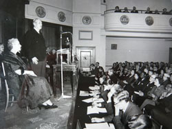 Prime Minister Harold Macmillan addressing an audience at the Royal Empire Society after returning from a Commonwealth tour, March 1958