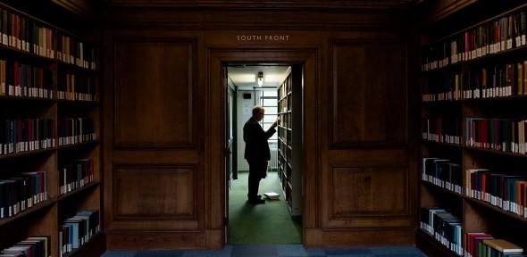 Library user browsing shelves on South Front